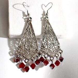 Ornate filigree metal earrings with garnet Austrian crystal dangles